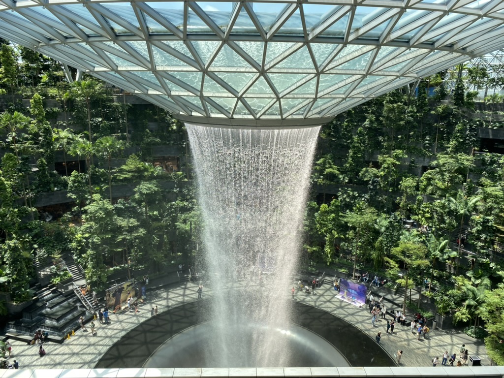 a water fall in a glass dome