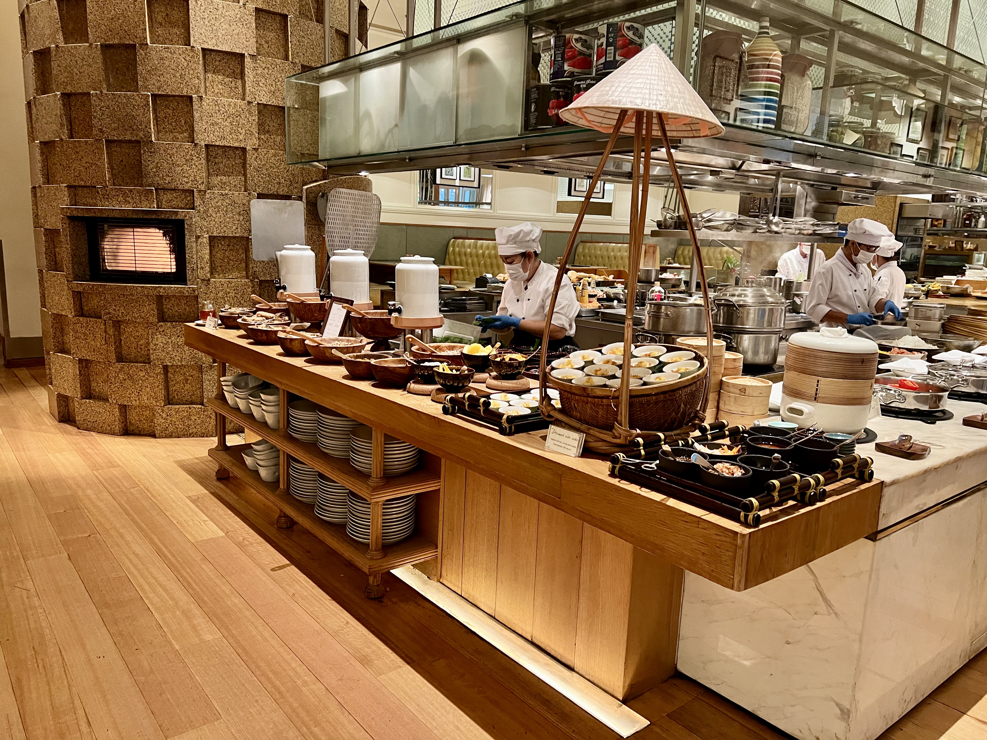 a group of chefs cooking in a restaurant