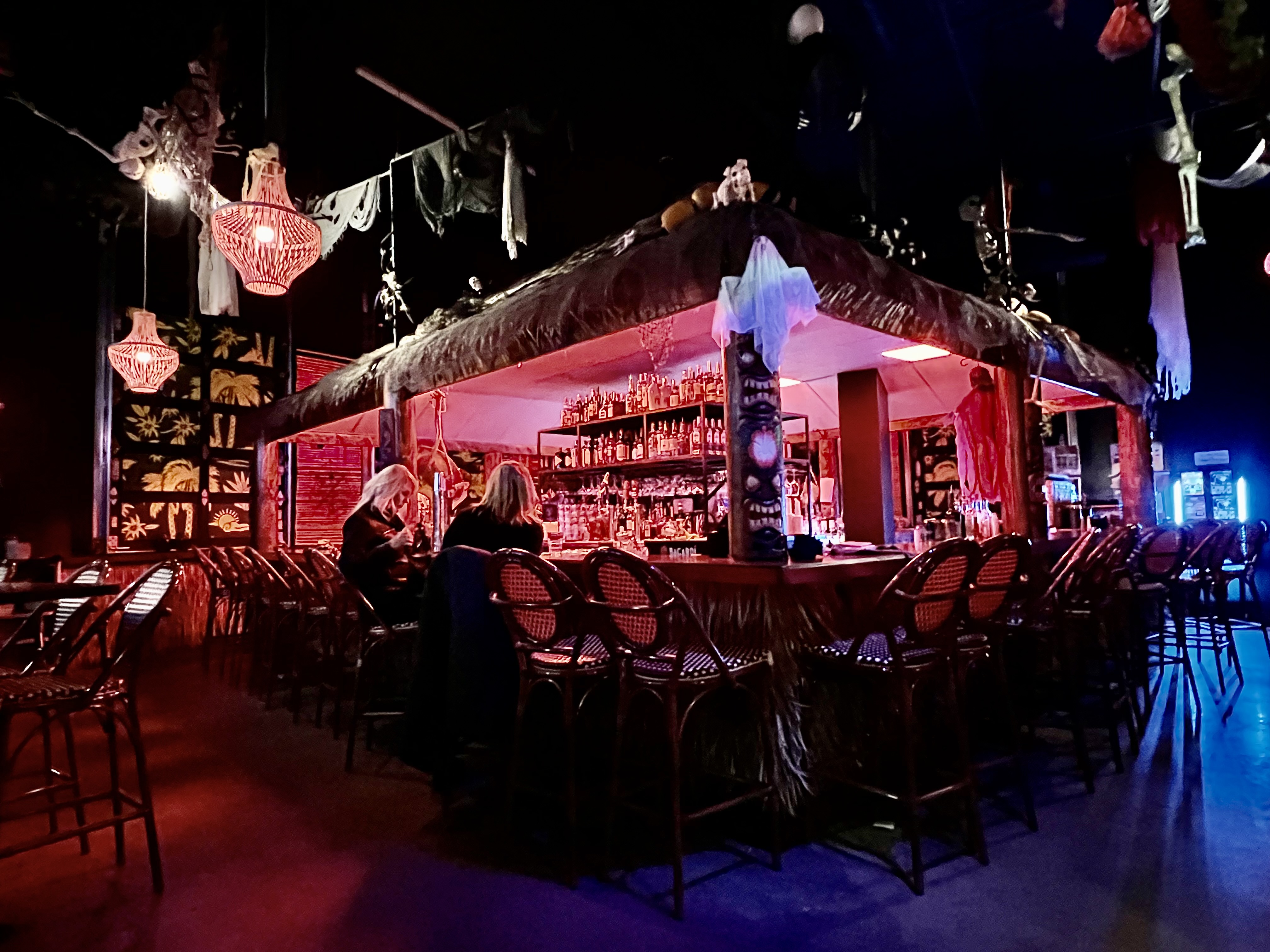 a bar with a bar and chairs