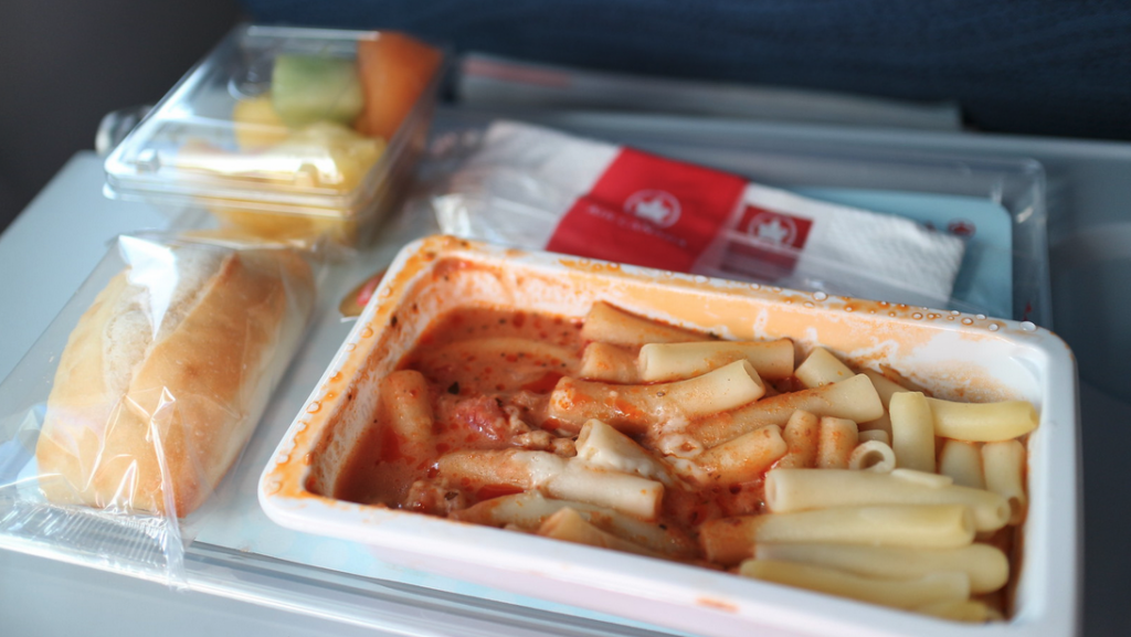 a tray of pasta and sauce