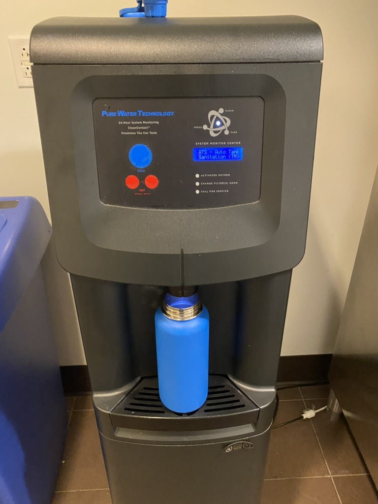 a water cooler with a blue bottle