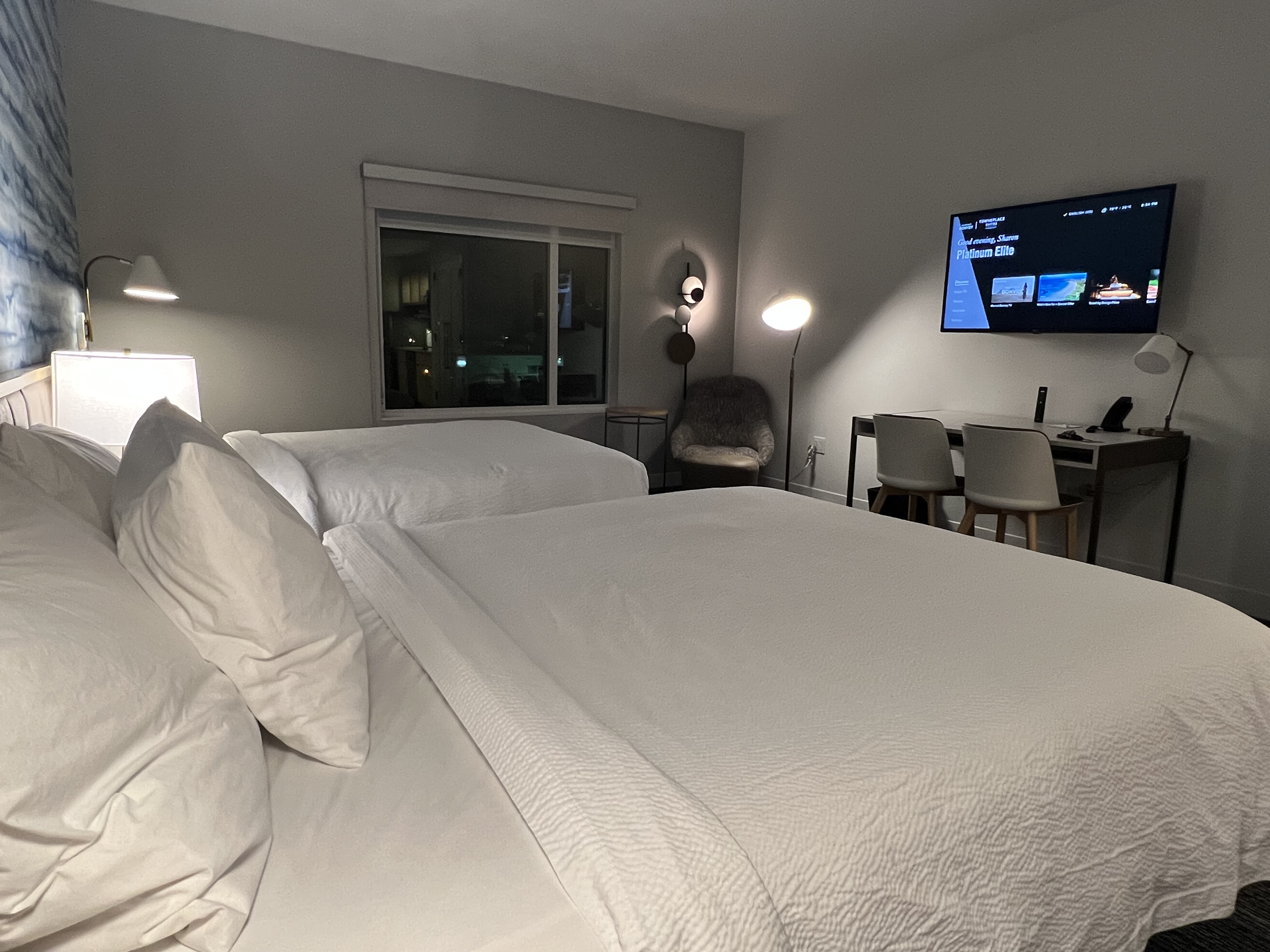a room with a television and a bed