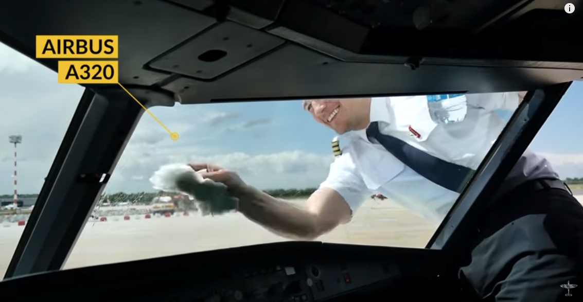 a man in uniform washing his hand