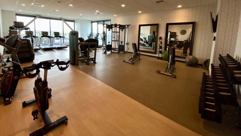 a large room with exercise equipment