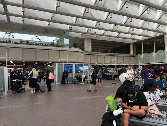 a group of people in an airport