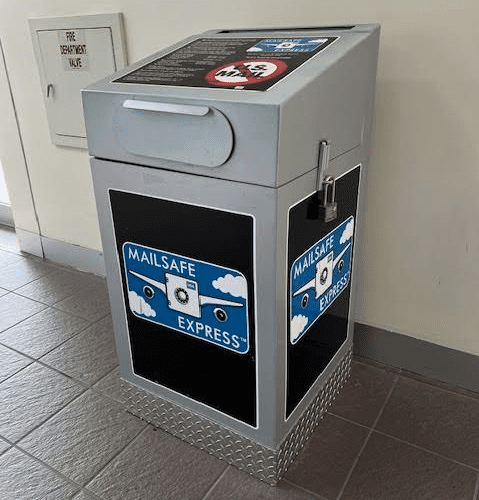 a mailbox with stickers on it