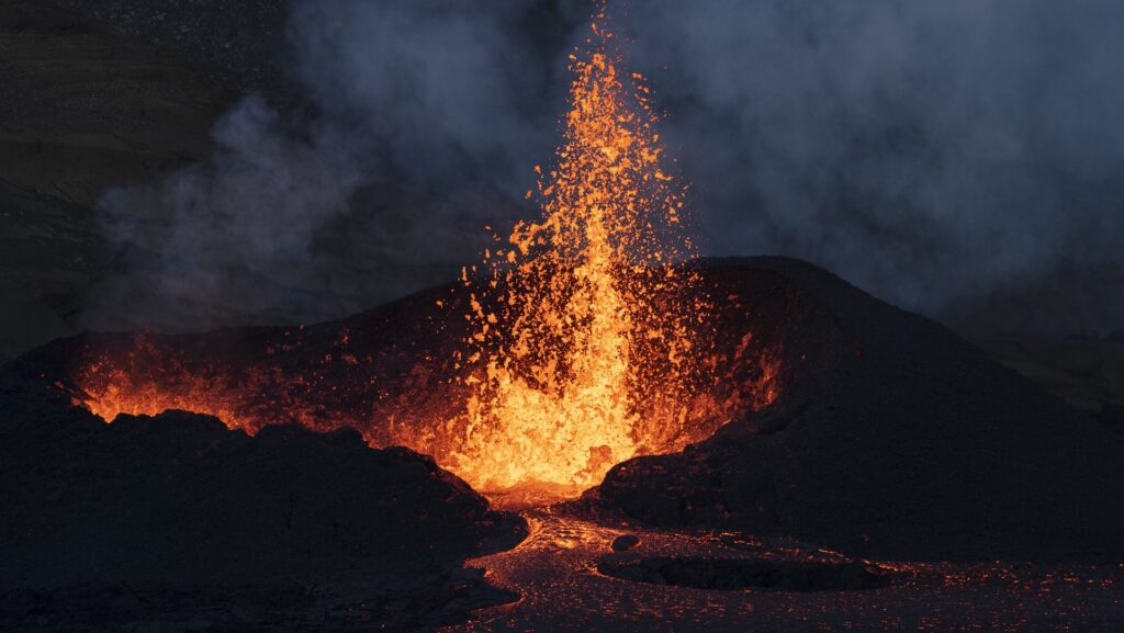 a volcano erupting with lava