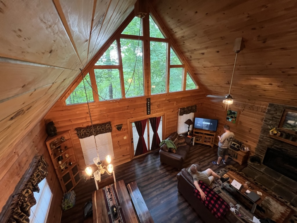 a room with a large window and a couple of men in it