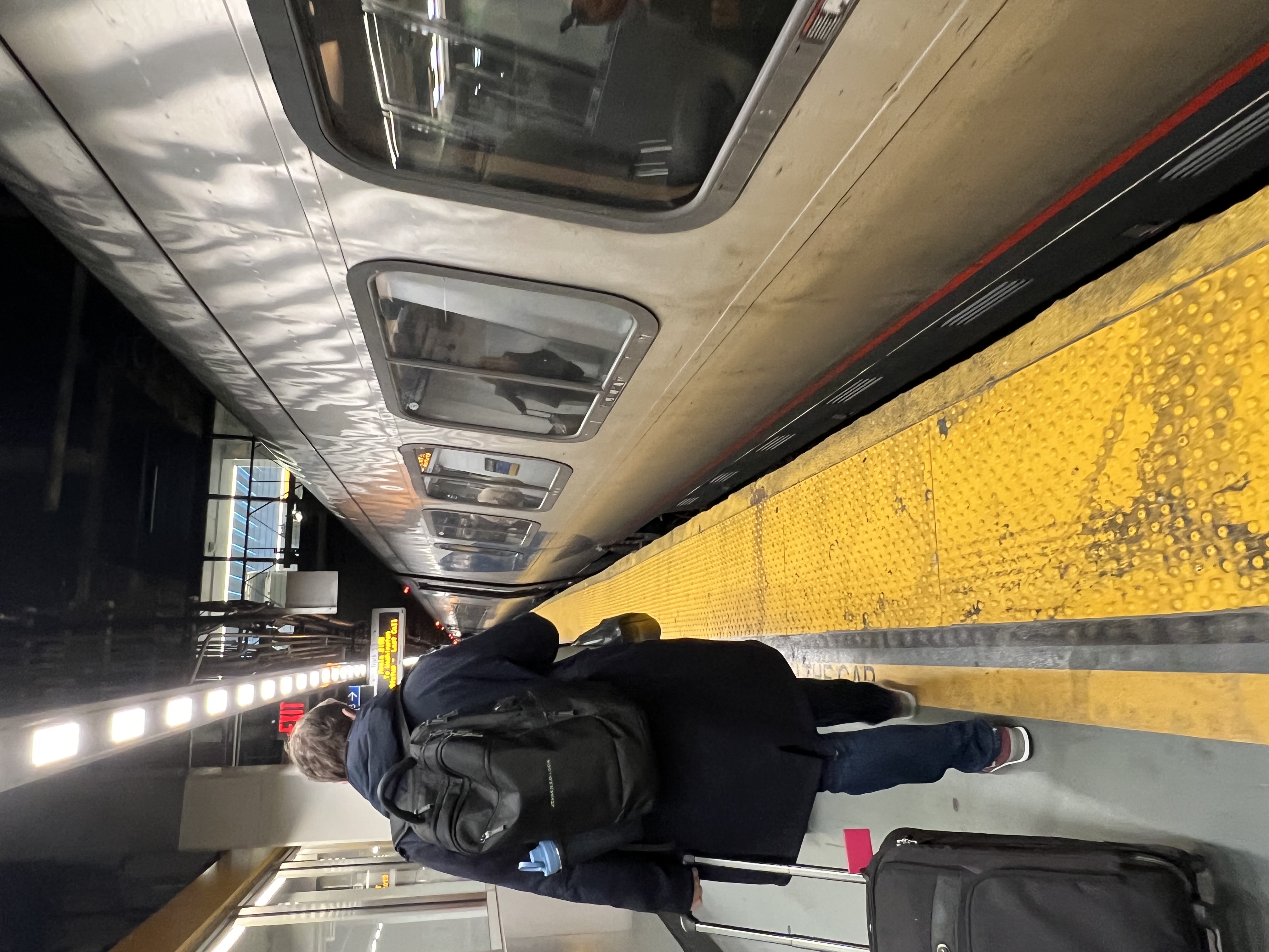 a person walking on a train platform