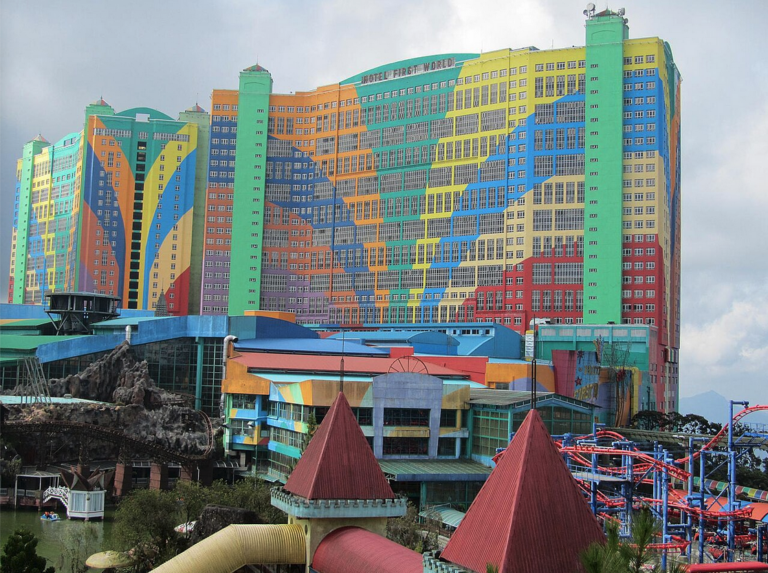 a multi colored building with a roller coaster