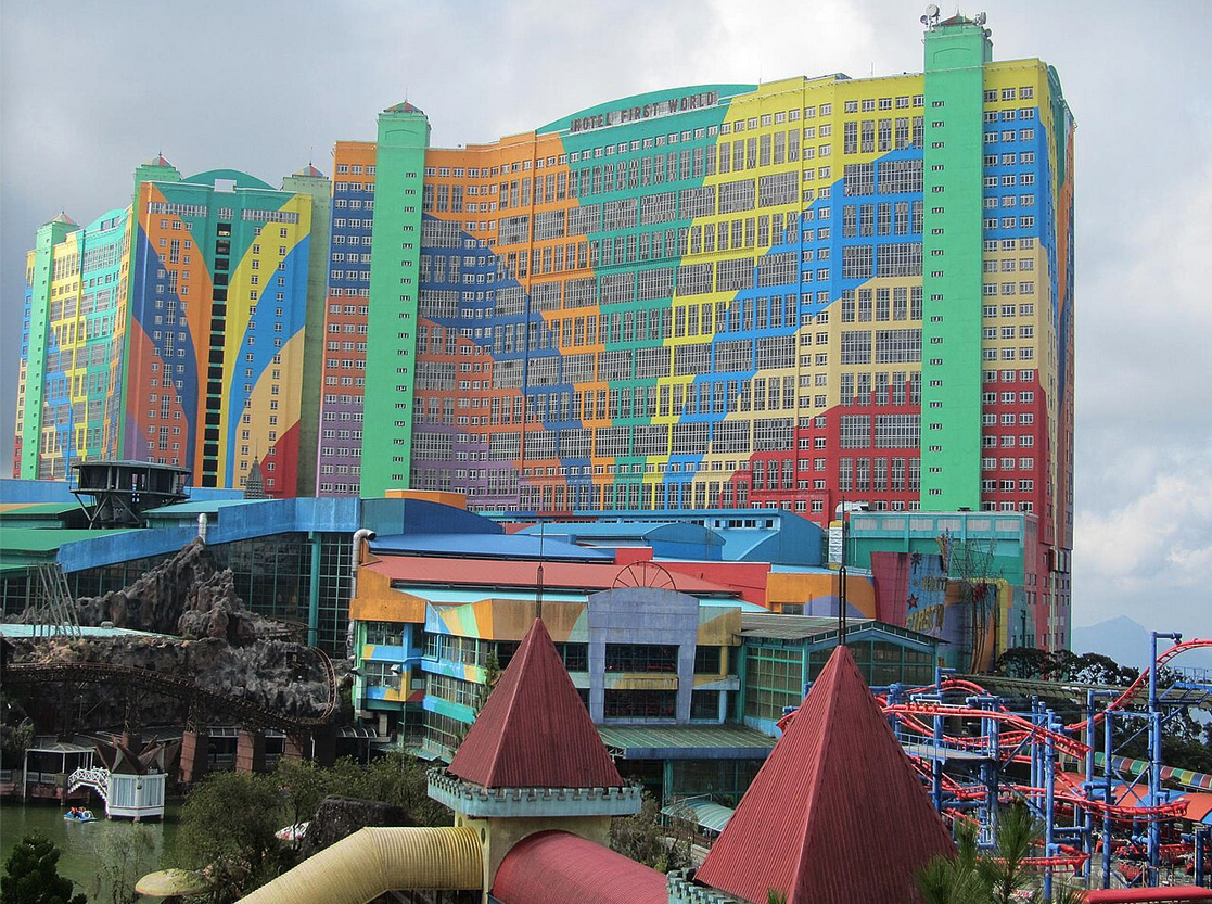 a multi-colored building with a roller coaster