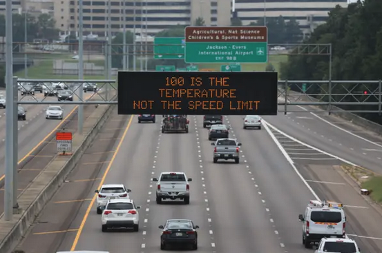 a highway with a digital sign