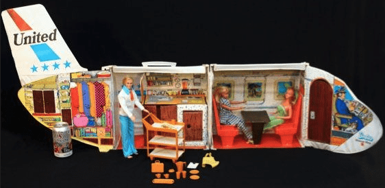 a doll house with a couple of dolls