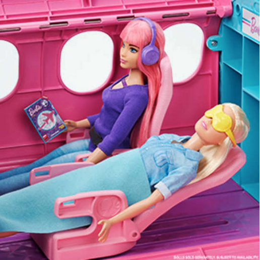 a barbie doll in a pink airplane