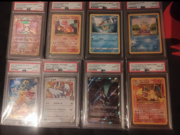 a collection of cards in plastic cases
