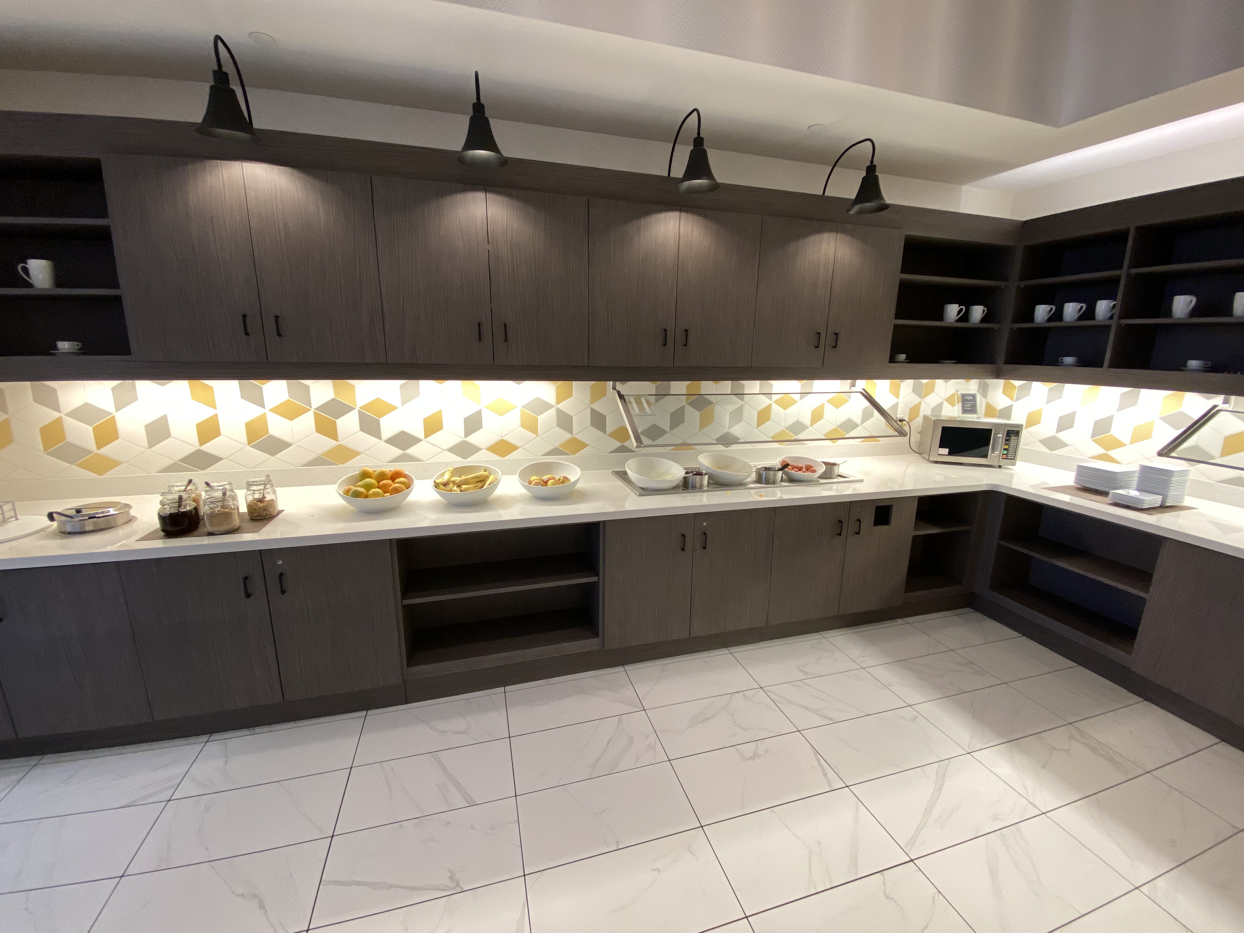 a kitchen with a variety of dishes on the counter