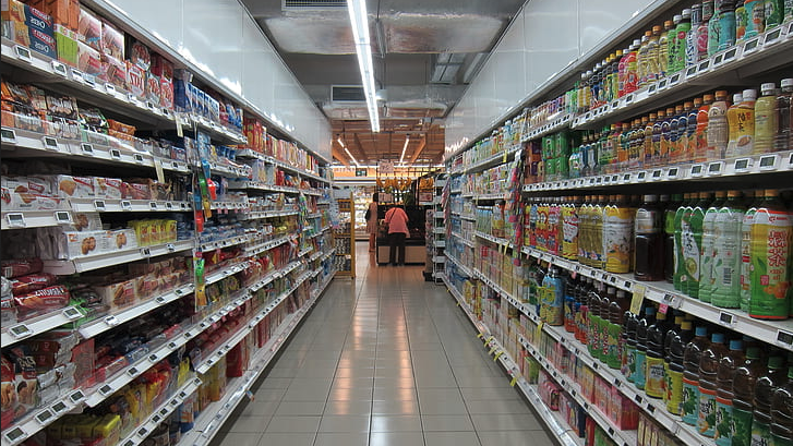 a store aisle with shelves of beverages