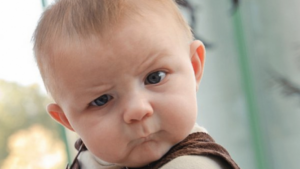 a baby with a serious expression