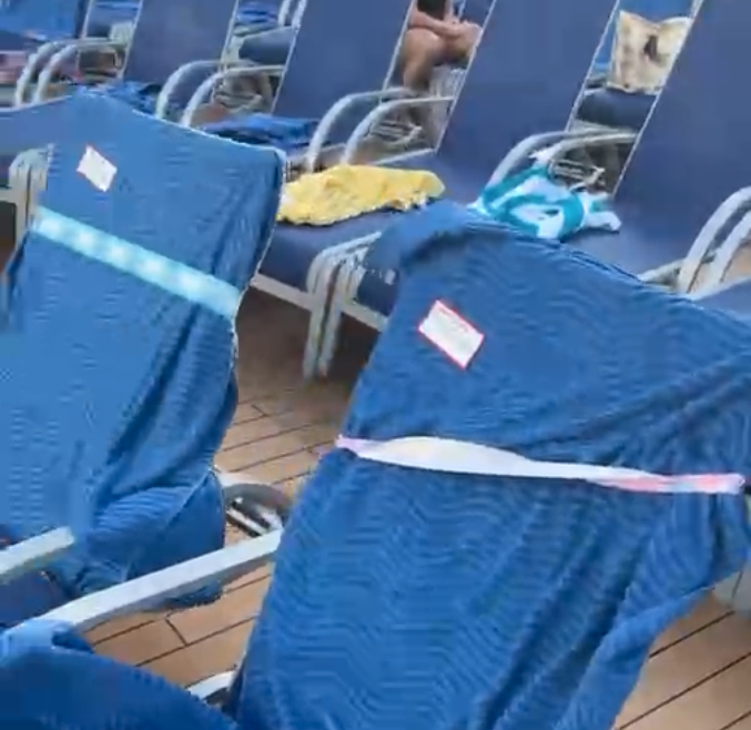 a group of blue chairs with a white tape around them