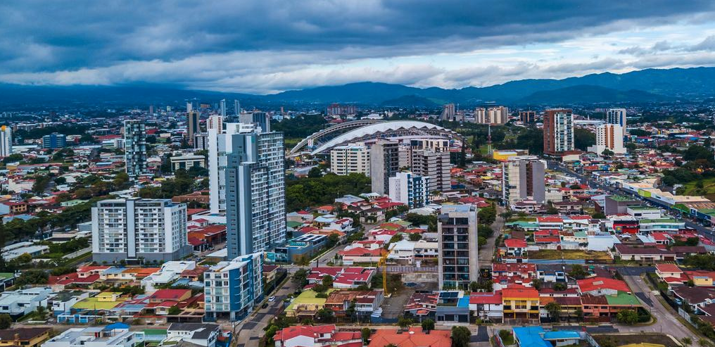 a city with many buildings and a bridge