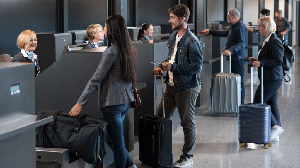 a group of people standing in an airport