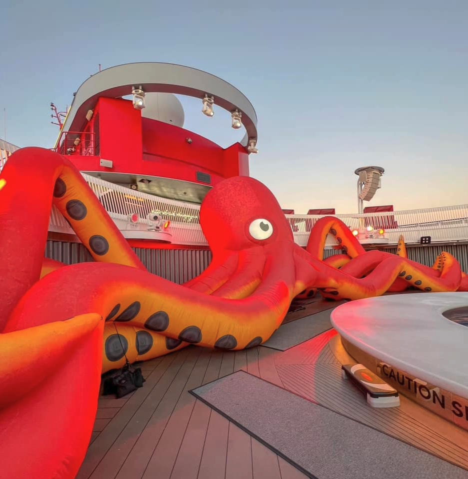 an inflatable octopus on a deck of a cruise ship