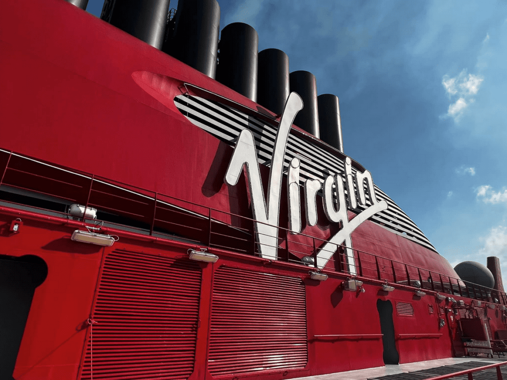 a large red ship with white text on it