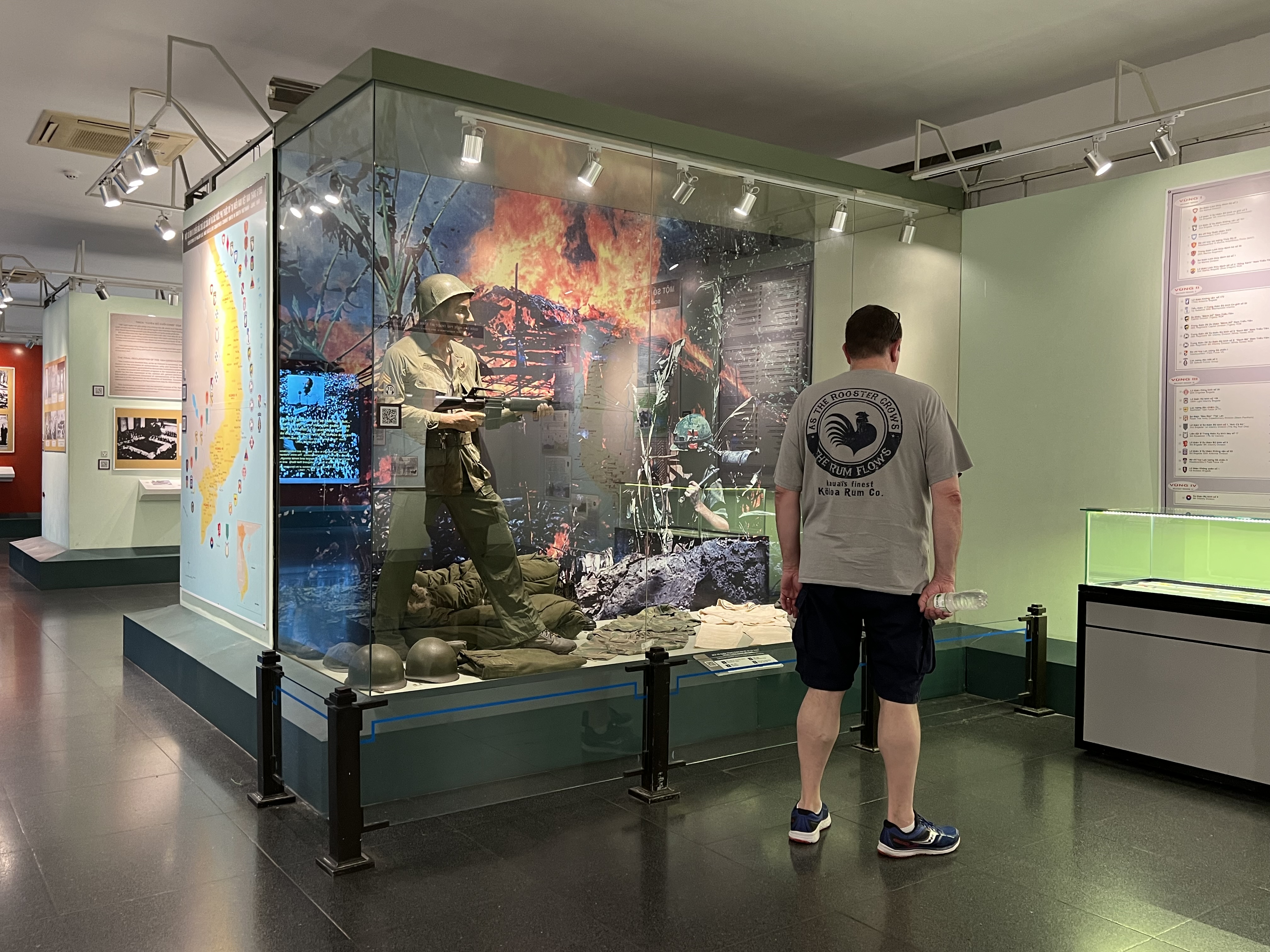 a man looking at a soldier in a glass case