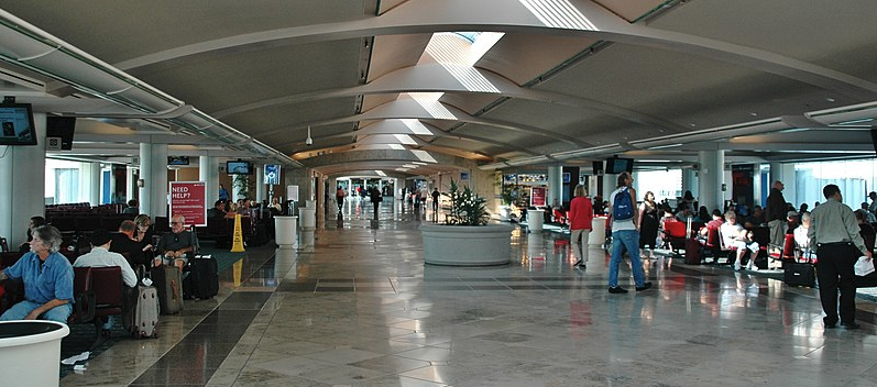 people walking in a large airport