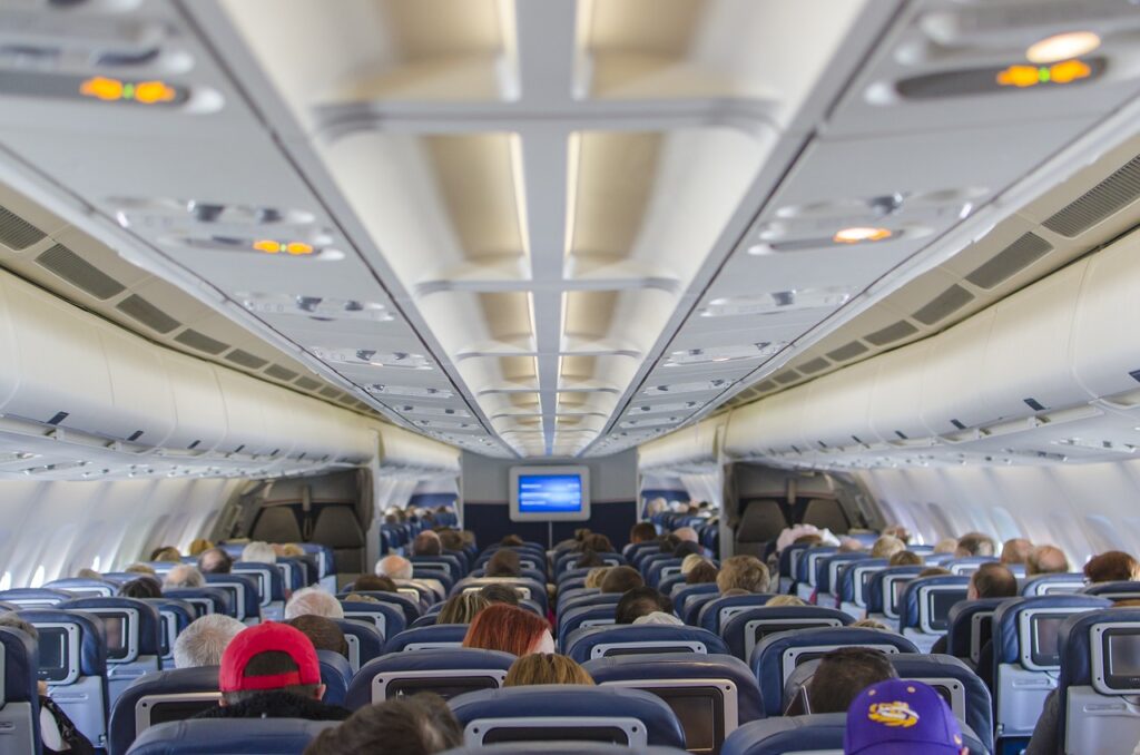 a group of people sitting in an airplane