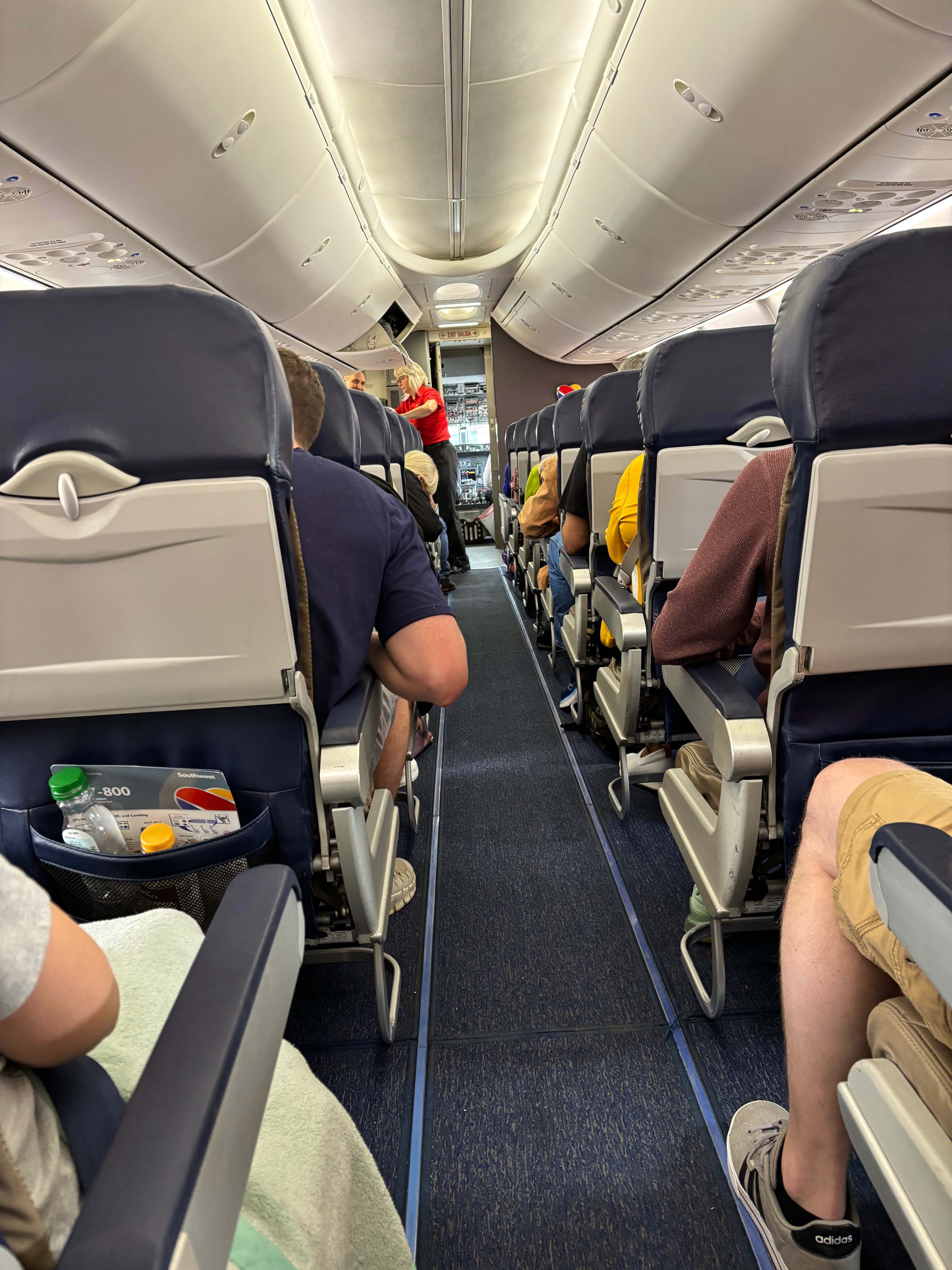 a group of people sitting in an airplane
