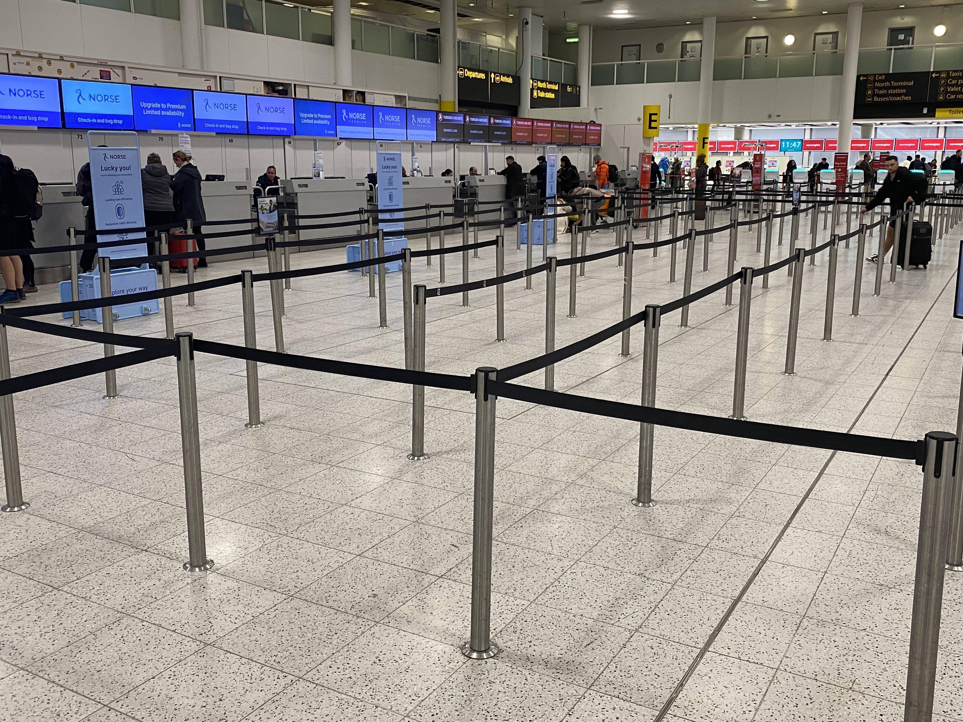 a line of people in an airport