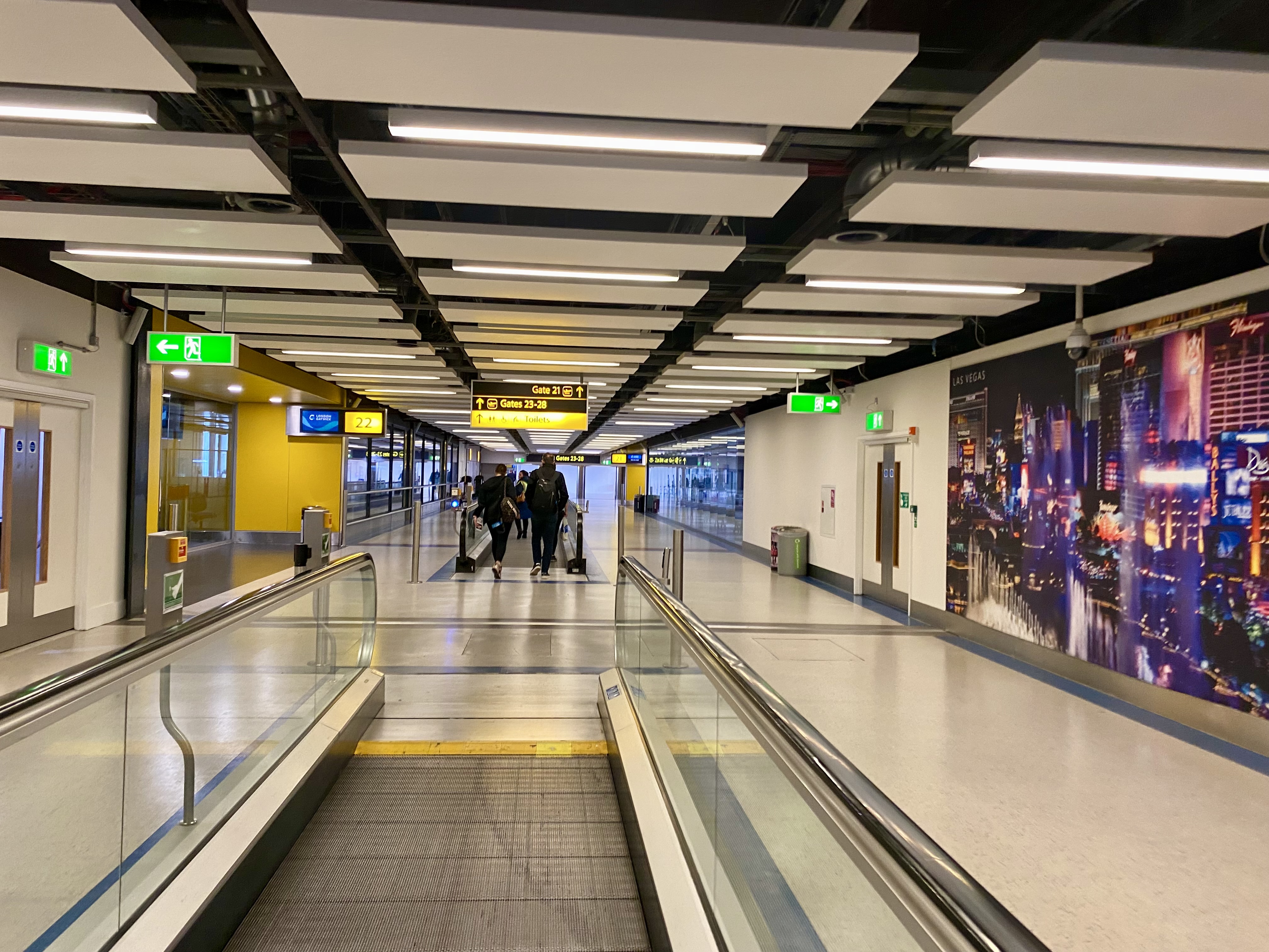 a group of people walking in a terminal