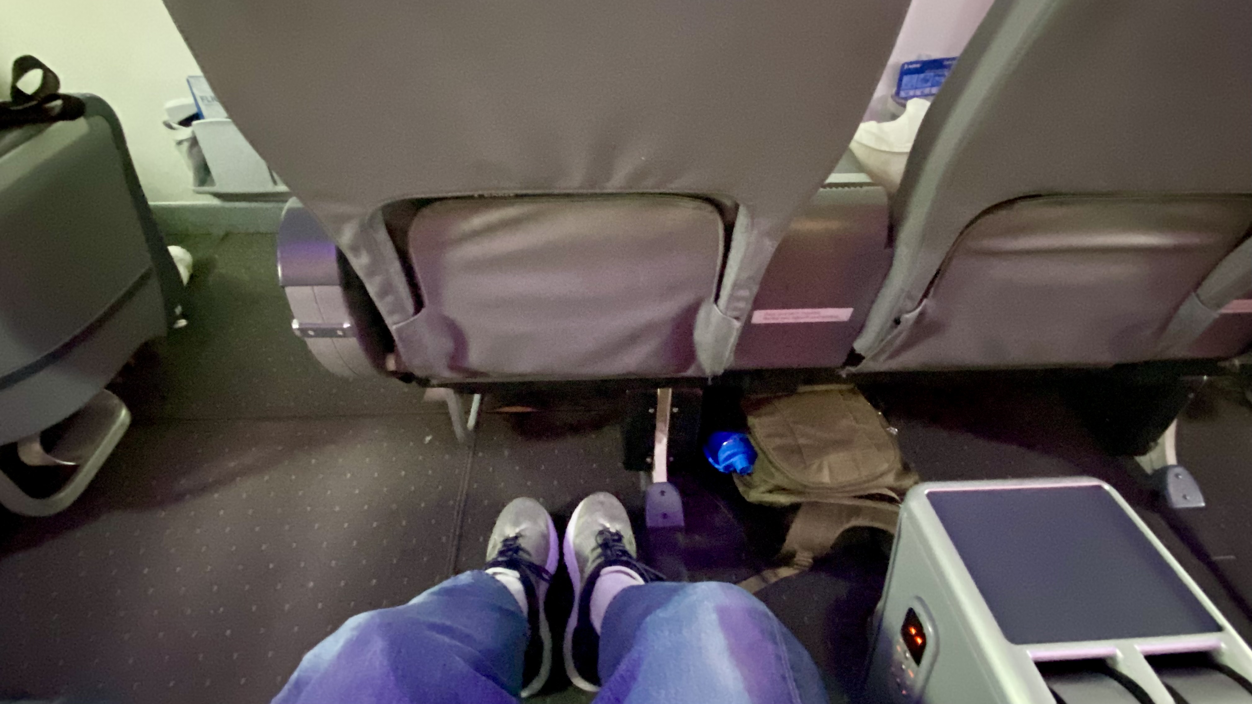 a person's legs in a seat