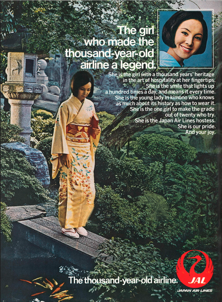 a woman in a kimono standing on a ledge