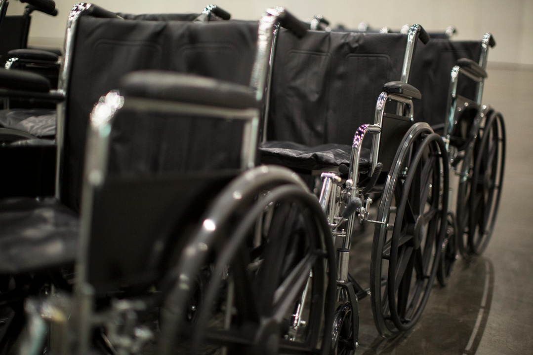 a wheelchairs lined up in rows