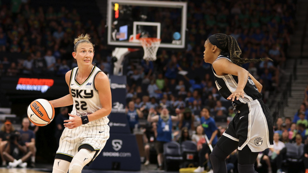 a group of women playing basketball