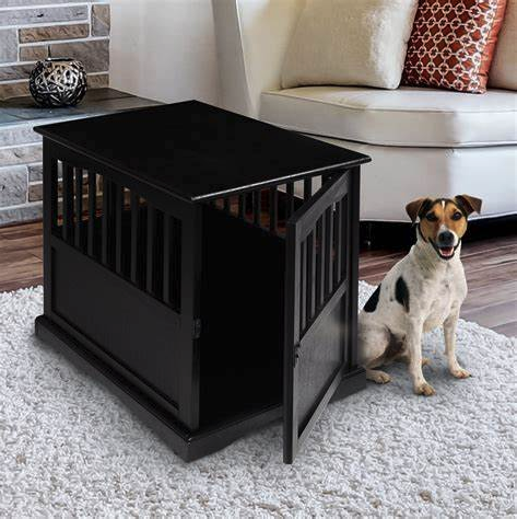 a dog sitting next to a dog kennel