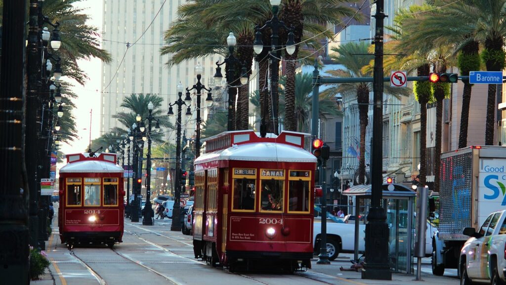 a trolleys on a street with Lincoln Road in the background