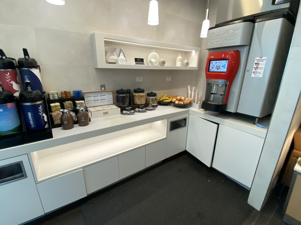 a kitchen with a machine and a drink dispenser