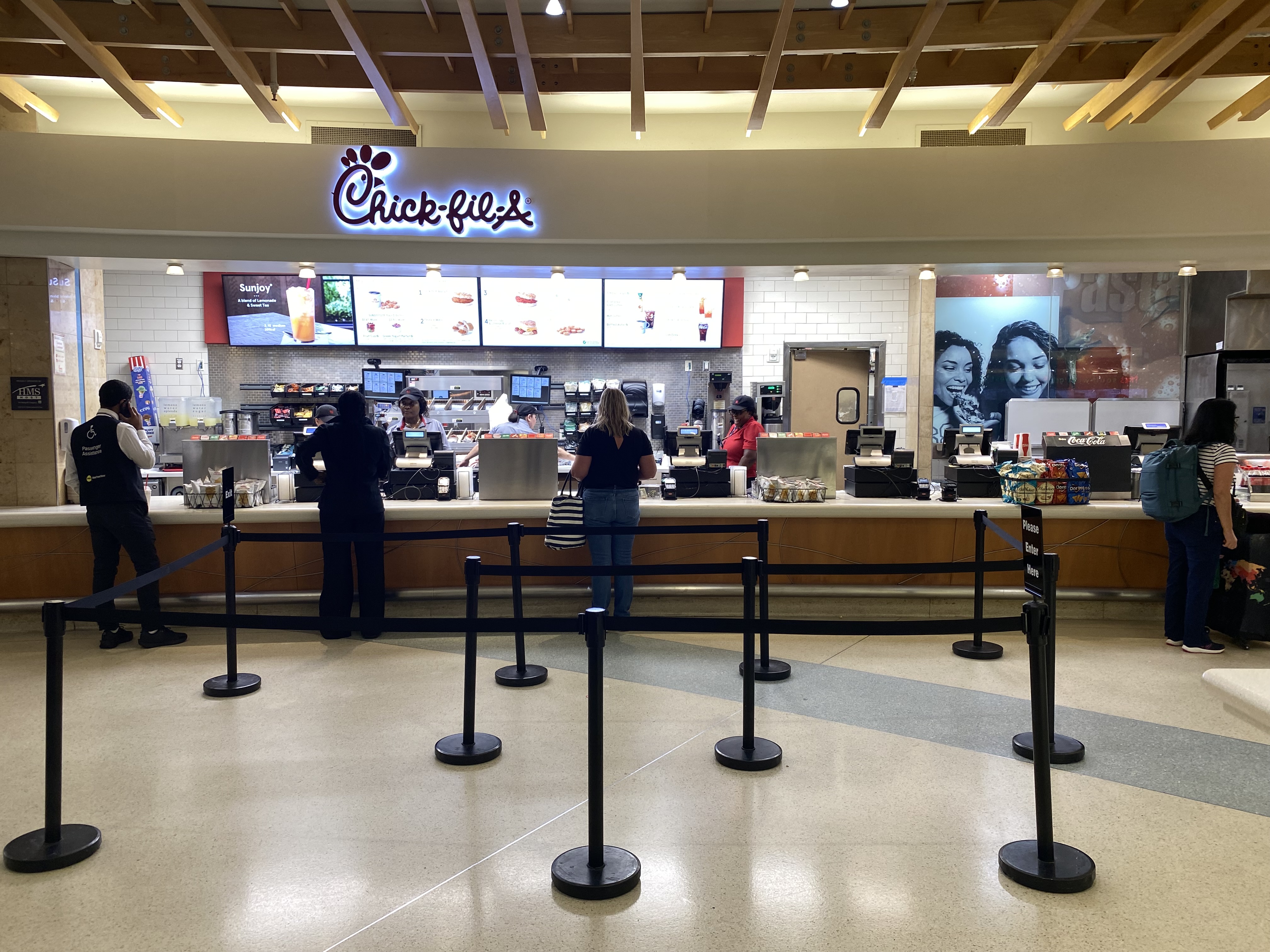 people standing in front of a food court