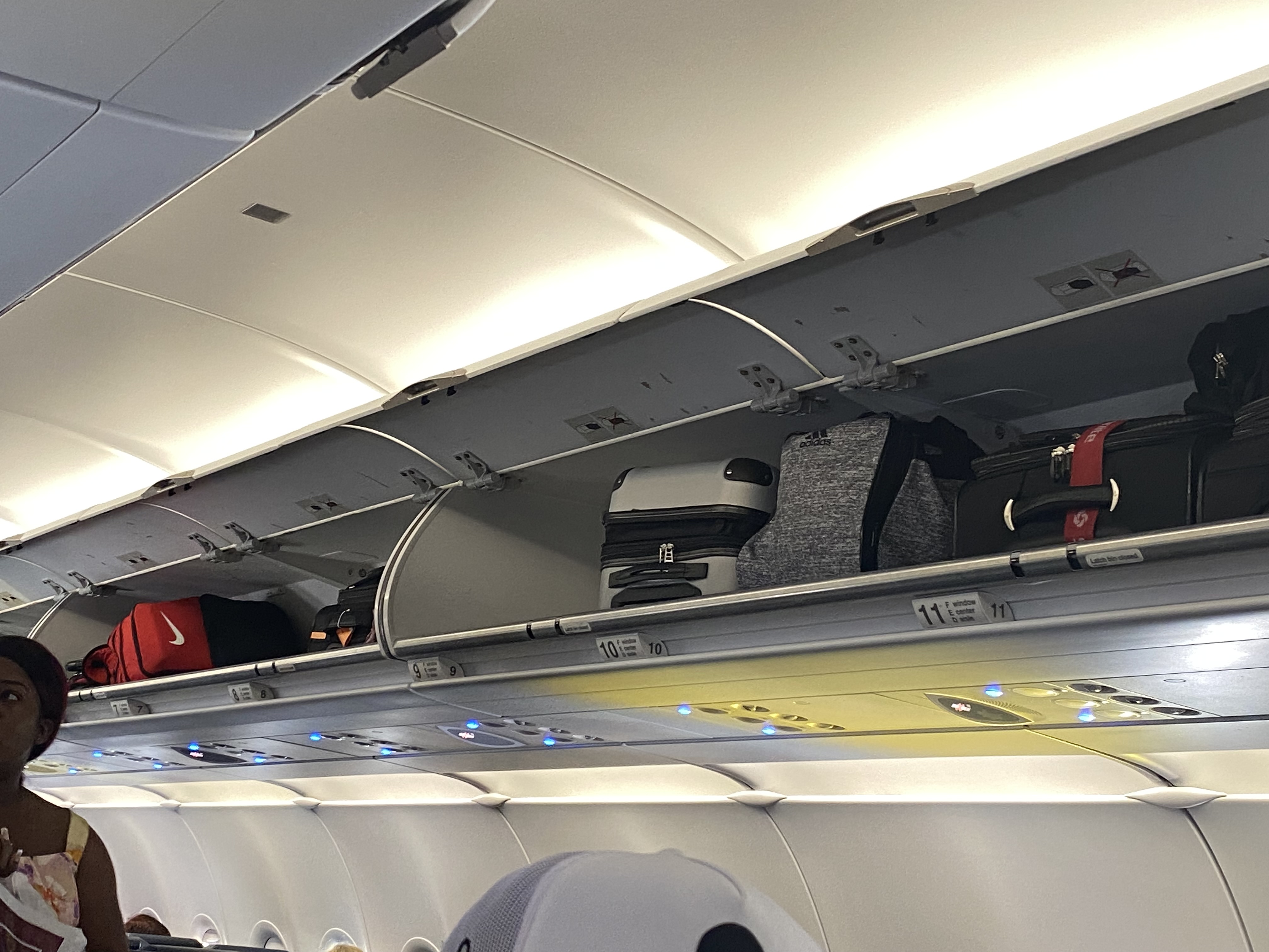 luggage on the shelf of an airplane