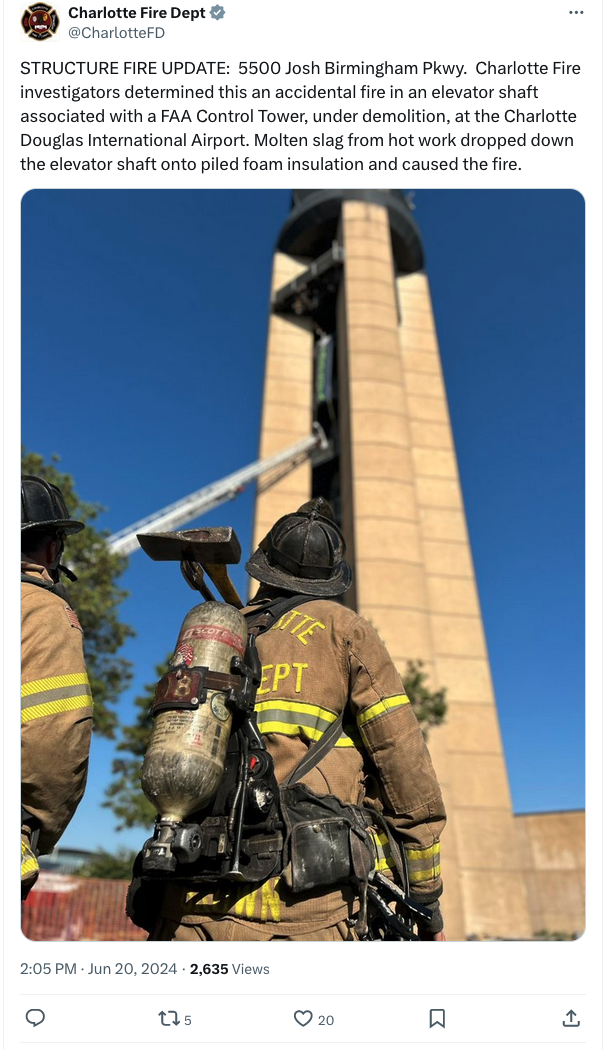 a firemen standing in front of a tower