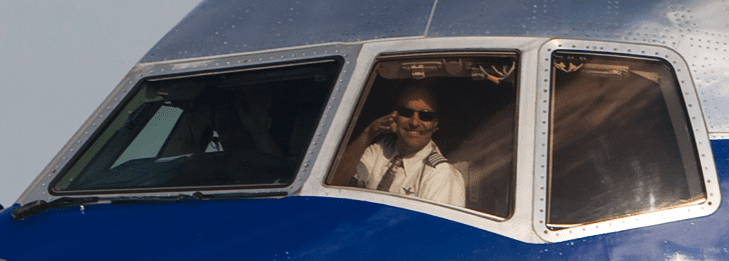 a man in the cockpit of an airplane