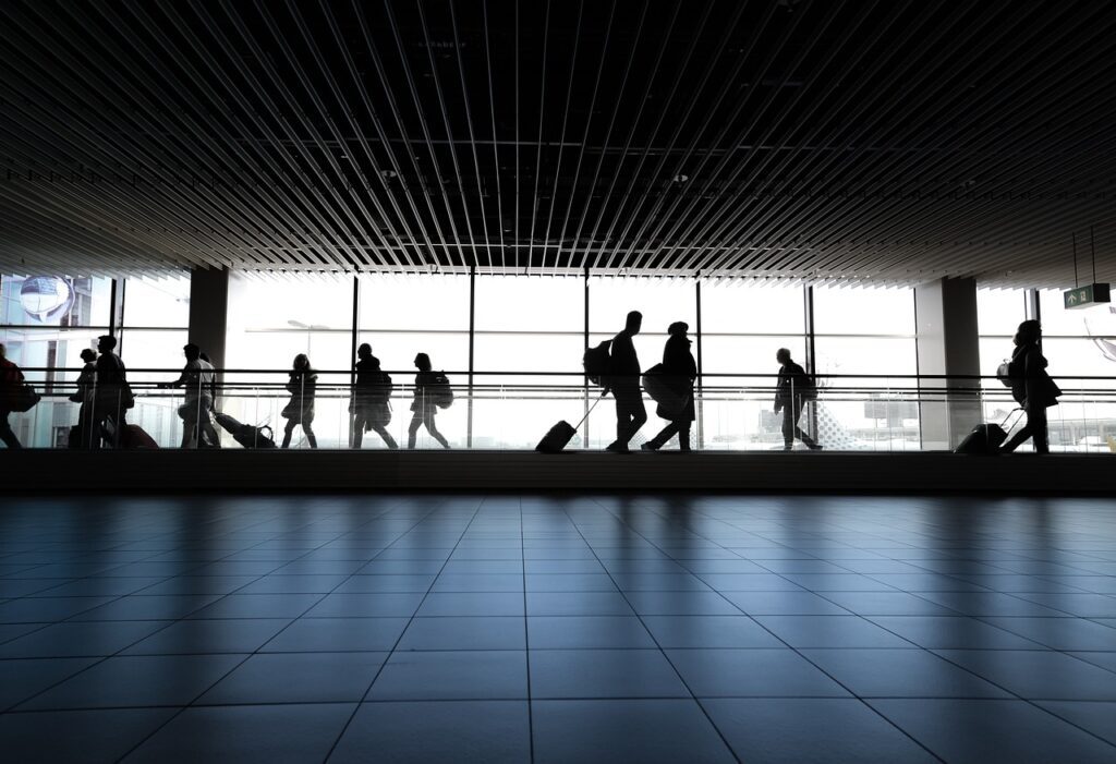 a group of people walking in a building