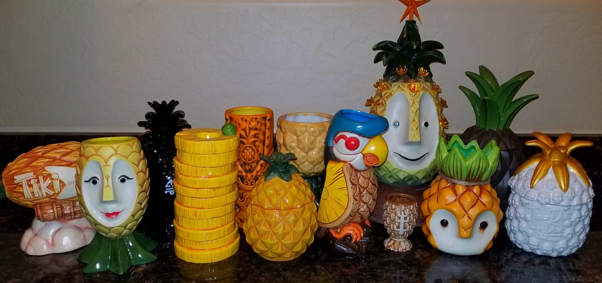 a group of pineapple figurines and stacks of coins