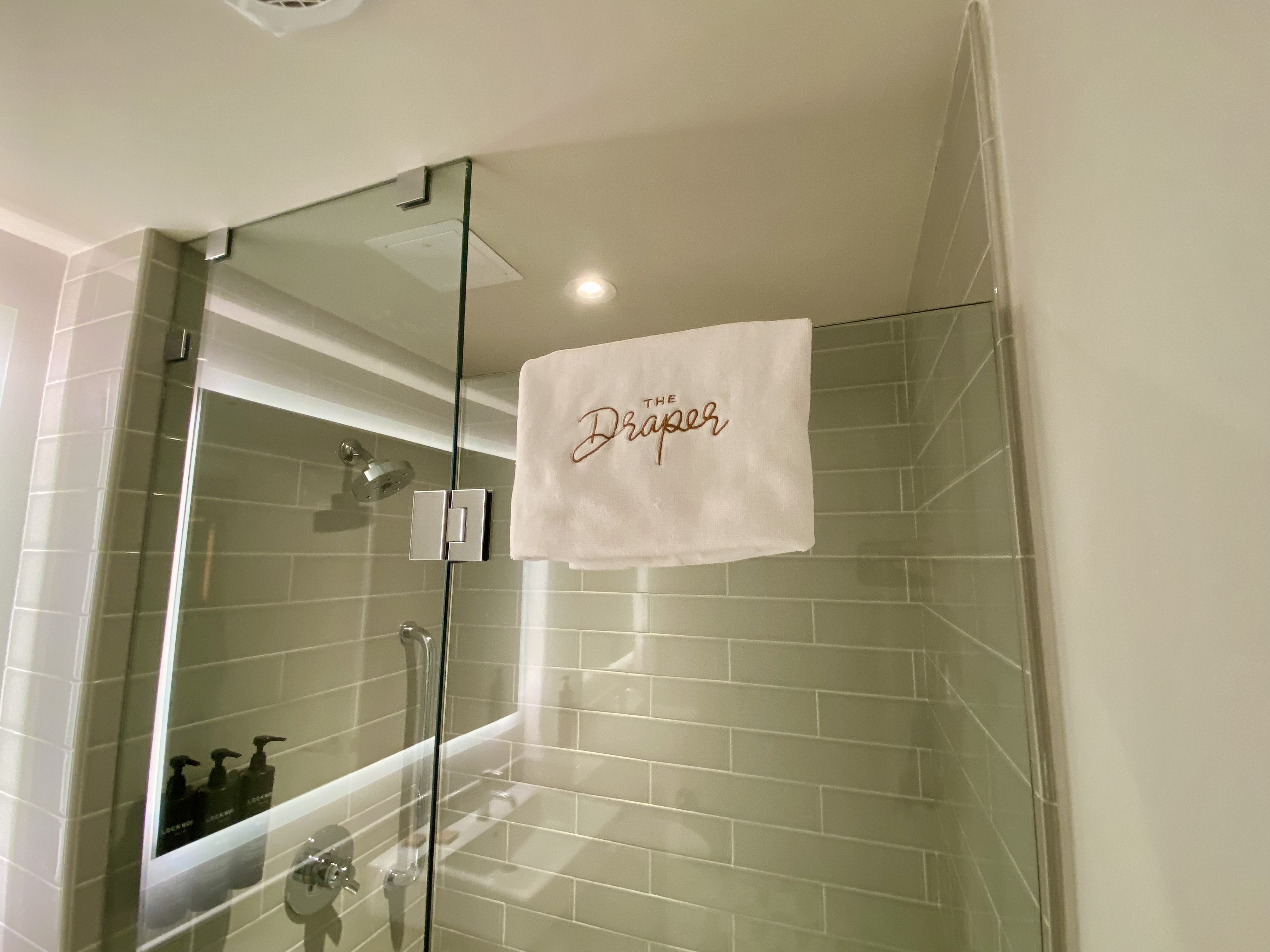 a towel on a glass shower door