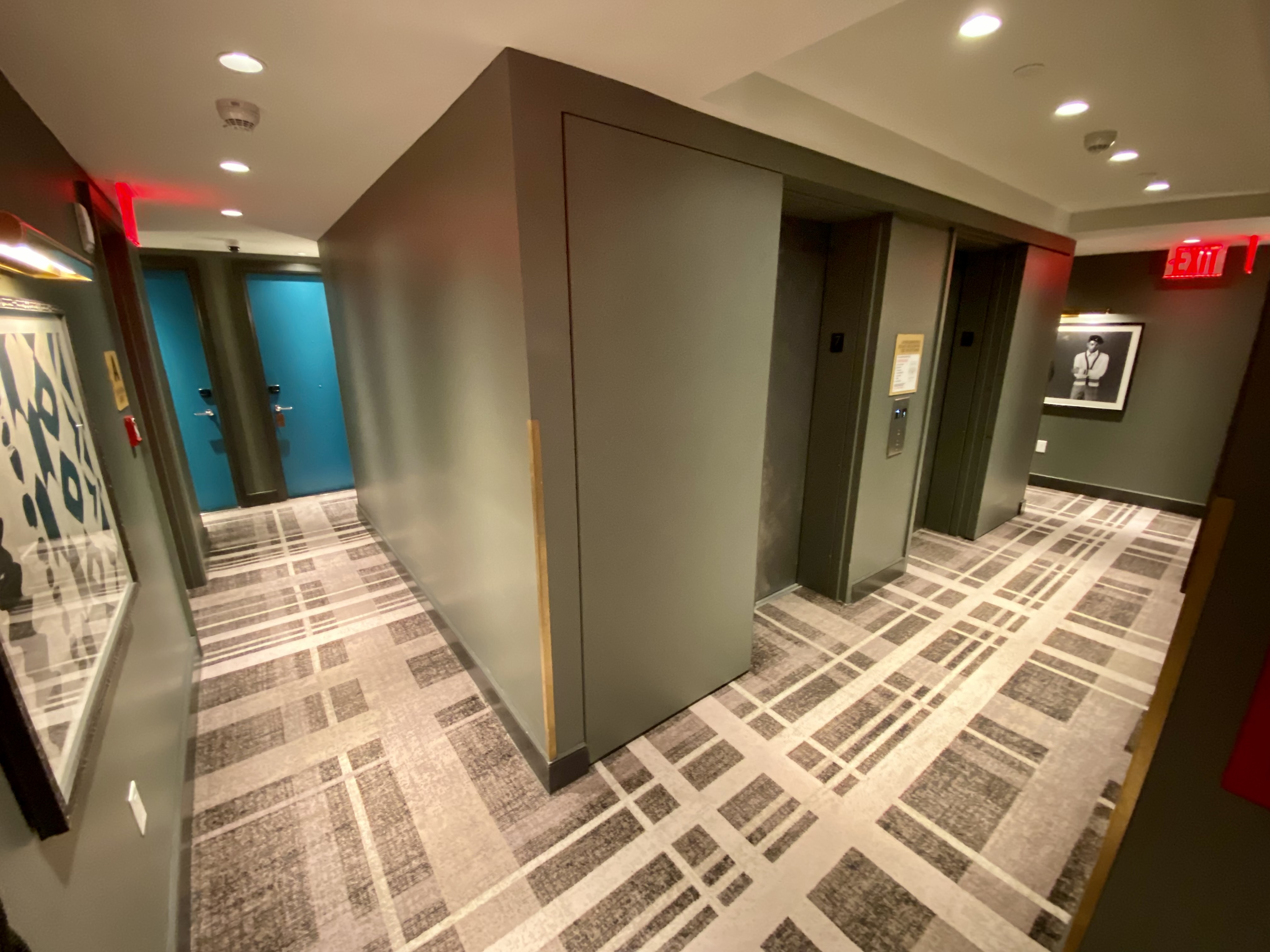 a hallway with elevators and doors