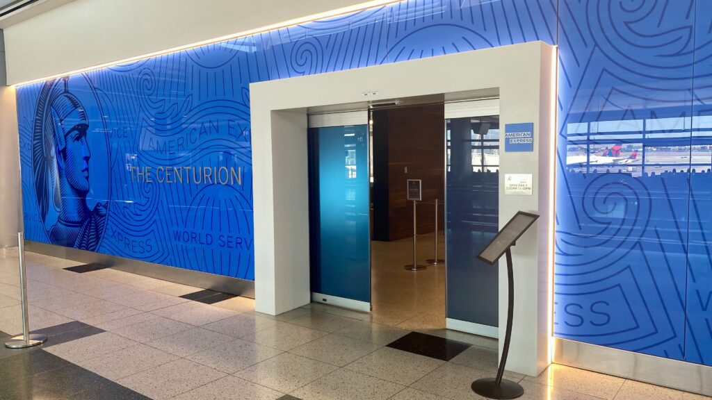 an elevator with a blue wall behind it