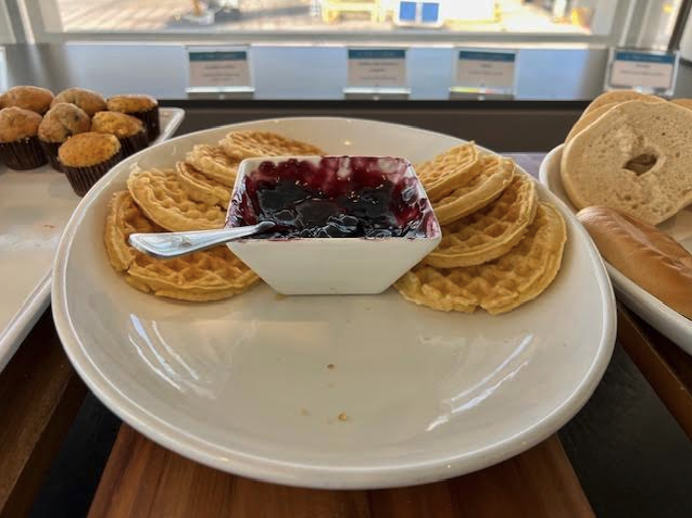 a plate of waffles and jam